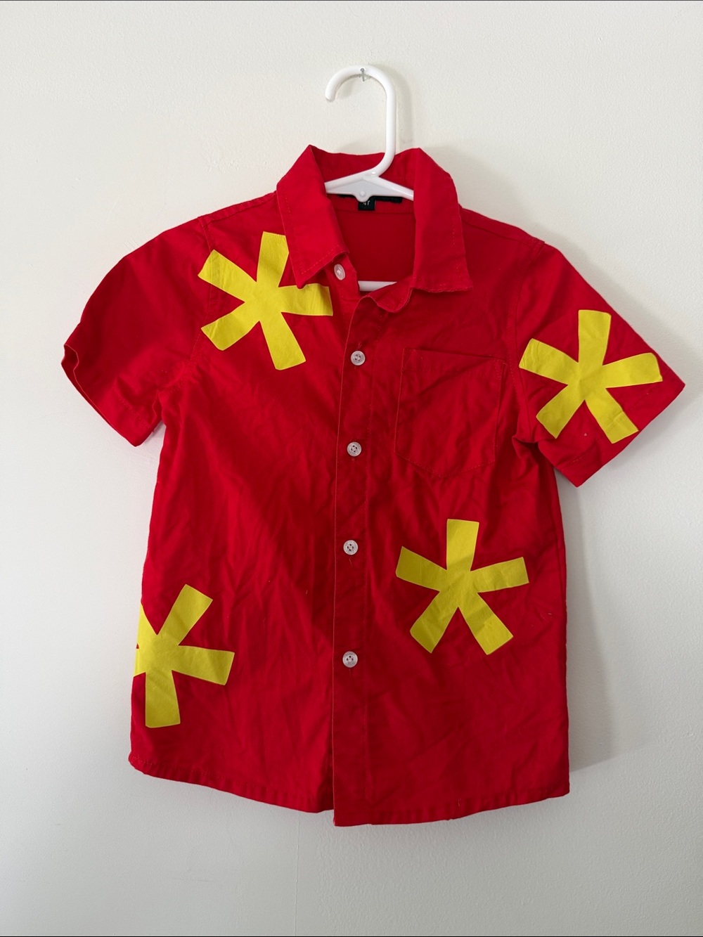 Red Short-Sleeve Kids Button-Up Shirt with Yellow Starburst Accents